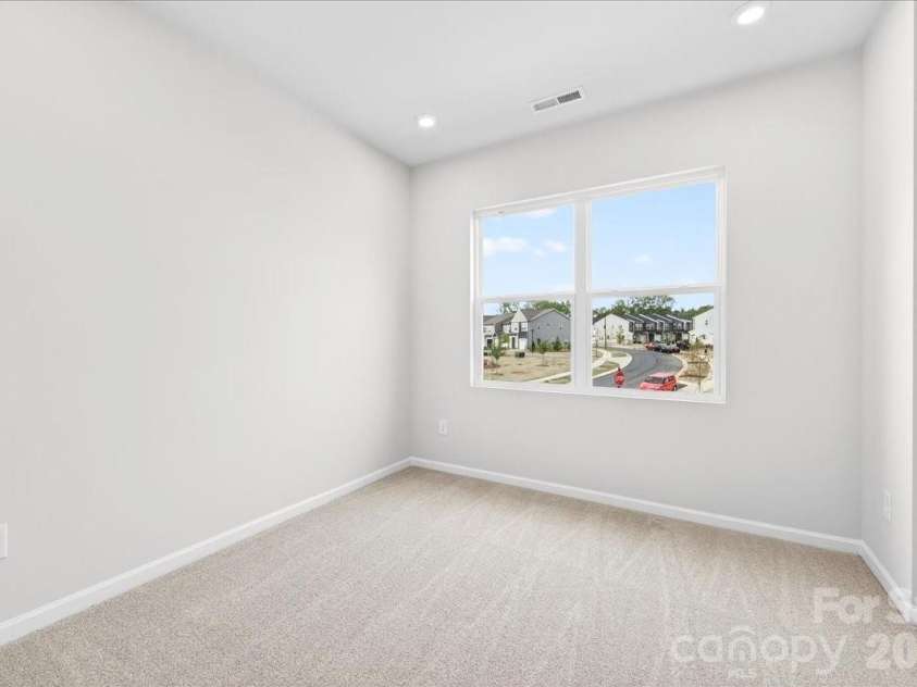 6053 Longar Lane, Charlotte, NC 28269.  MLS# CAR4368932, YatesRealty ID 28239. Secondary bedroom