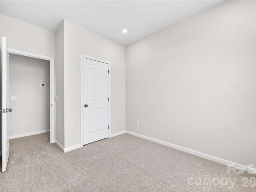 6053 Longar Lane, Charlotte, NC 28269.  MLS# CAR4368932, YatesRealty ID 28239. Secondary bedroom
