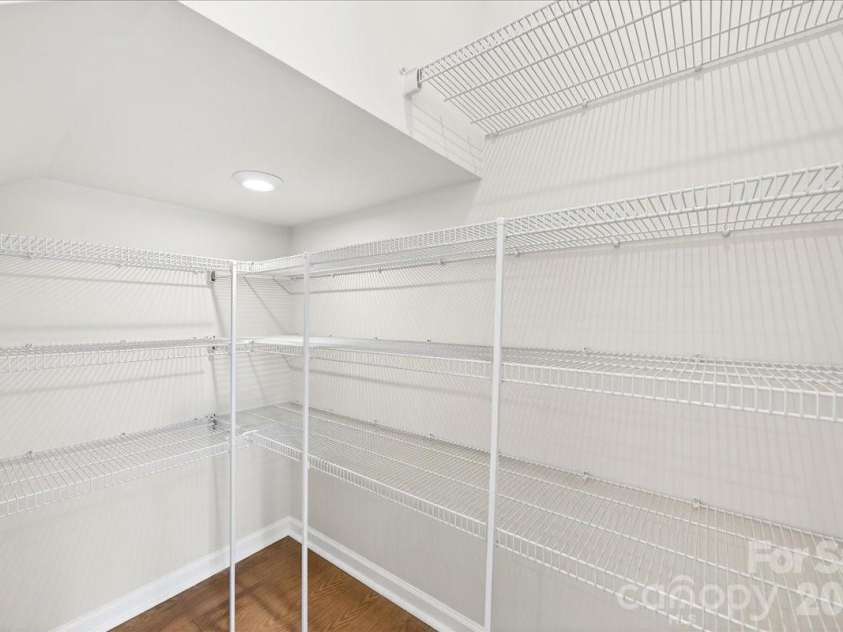 6053 Longar Lane, Charlotte, NC 28269.  MLS# CAR4368932, YatesRealty ID 28239. Walk-in kitchen pantry 
