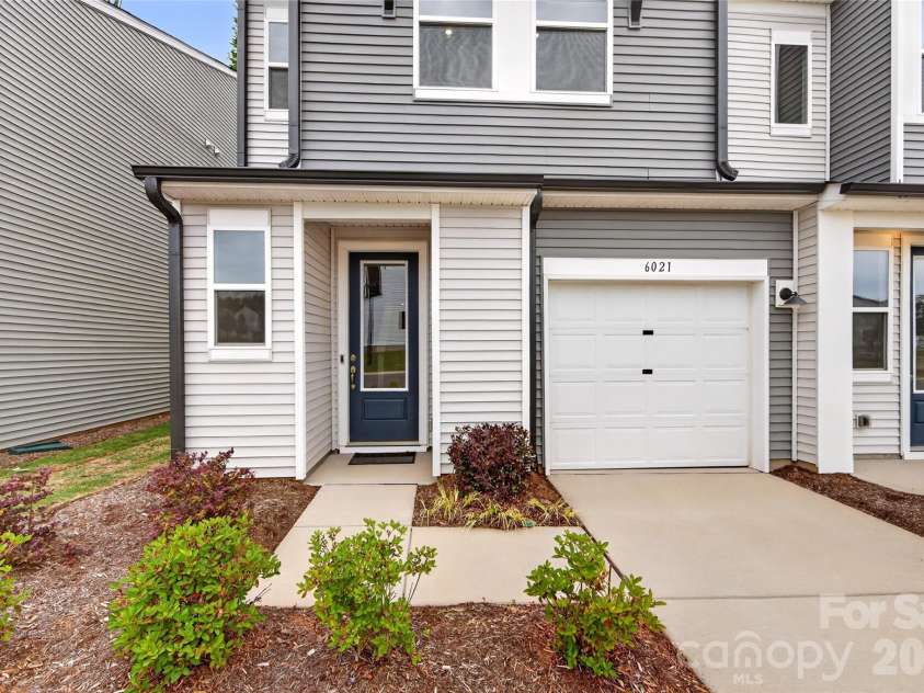6021 Longar Lane, Charlotte, NC 28269.  MLS# CAR4376915, YatesRealty ID 28240. Covered front door