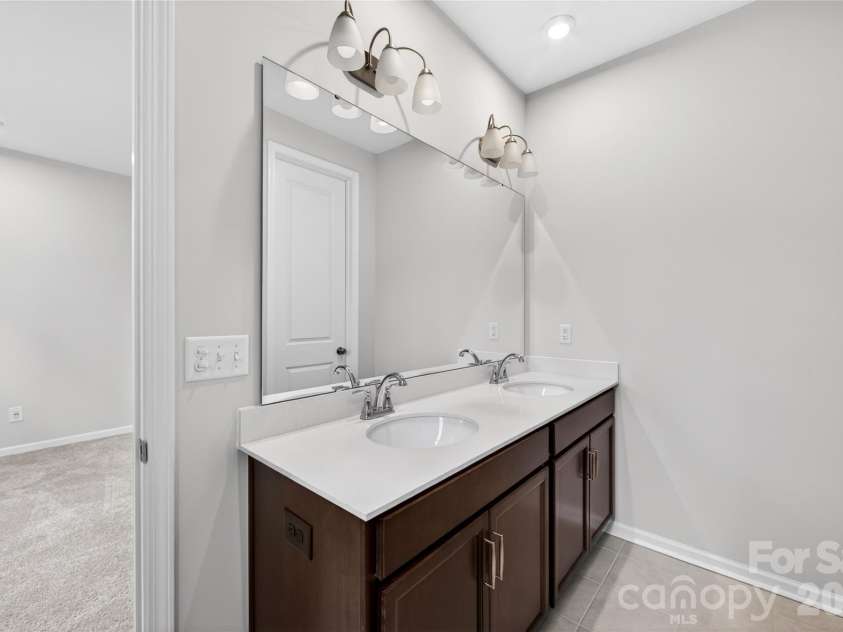 6021 Longar Lane, Charlotte, NC 28269.  MLS# CAR4376915, YatesRealty ID 28240. Dual vanity bathroom