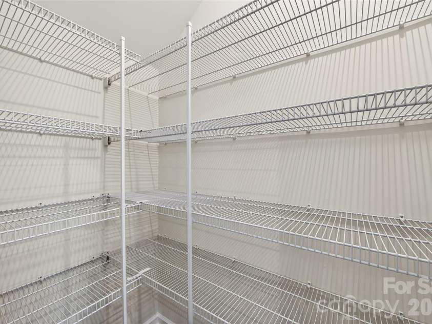 6021 Longar Lane, Charlotte, NC 28269.  MLS# CAR4376915, YatesRealty ID 28240. Large walk-in pantry