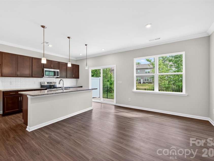 6021 Longar Lane, Charlotte, NC 28269.  MLS# CAR4376915, YatesRealty ID 28240. Open concept living