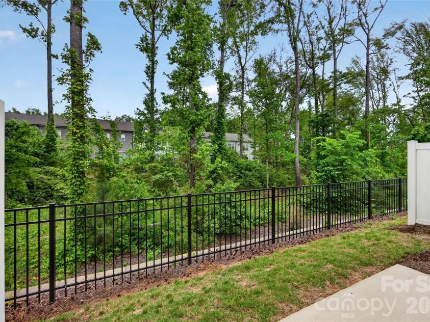 6021 Longar Lane, Charlotte, NC 28269.  MLS# CAR4376915, YatesRealty ID 28240. Outdoor living with tree-lined views