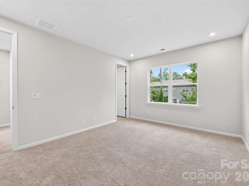 6021 Longar Lane, Charlotte, NC 28269.  MLS# CAR4376915, YatesRealty ID 28240. Primary bedroom