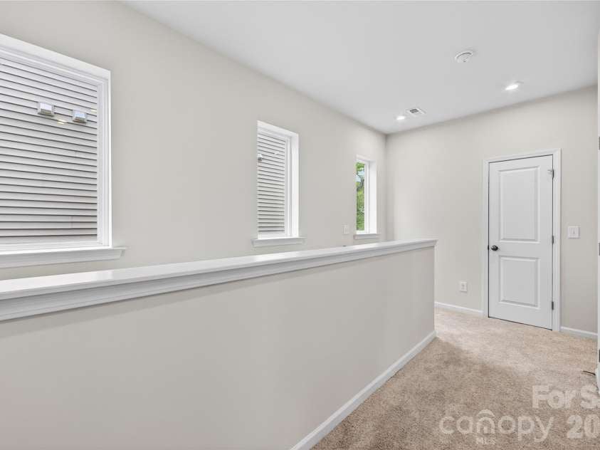 6021 Longar Lane, Charlotte, NC 28269.  MLS# CAR4376915, YatesRealty ID 28240. Second floor hallway