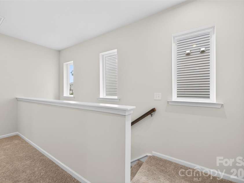 6021 Longar Lane, Charlotte, NC 28269.  MLS# CAR4376915, YatesRealty ID 28240. Second floor landing