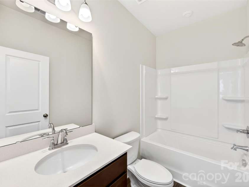 6021 Longar Lane, Charlotte, NC 28269.  MLS# CAR4376915, YatesRealty ID 28240. Secondary bathroom