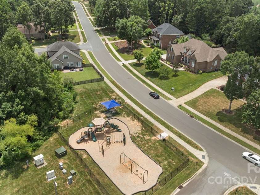 3018 Early Rise Avenue, Indian Trail, NC 28079.  MLS# CAR4283685, YatesRealty ID 28251. Community playground: a fun and safe space for kids to play and make friends.
