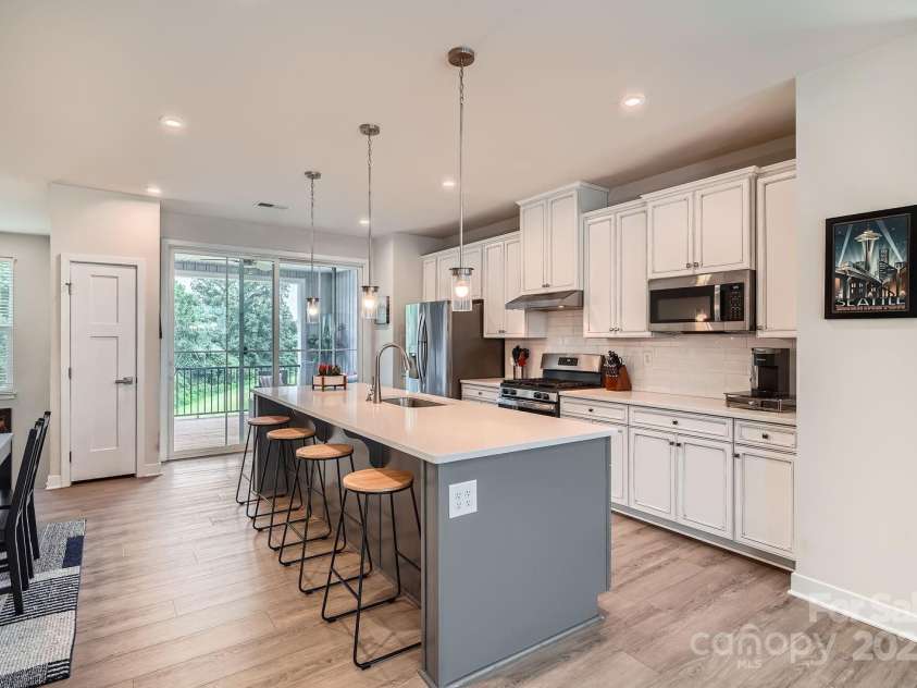 9729 Oaklawn Boulevard, Huntersville, NC 28078.  MLS# CAR4277701, YatesRealty ID 28252. Kitchen - Large Island, Quartz Counters, Gas Range, and Fridge INCLUDED!