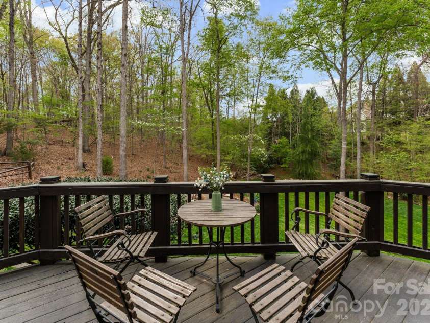 1514 Elmsford Lane, Matthews, NC 28105.  MLS# CAR4371432, YatesRealty ID 28254. Deck overlooking private wooded back yard