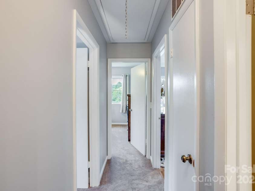 17 Lynwood Circle, Asheville, NC 28806.  MLS# CAR4282982, YatesRealty ID 28260. Hallway to 3 bedrooms on top floor