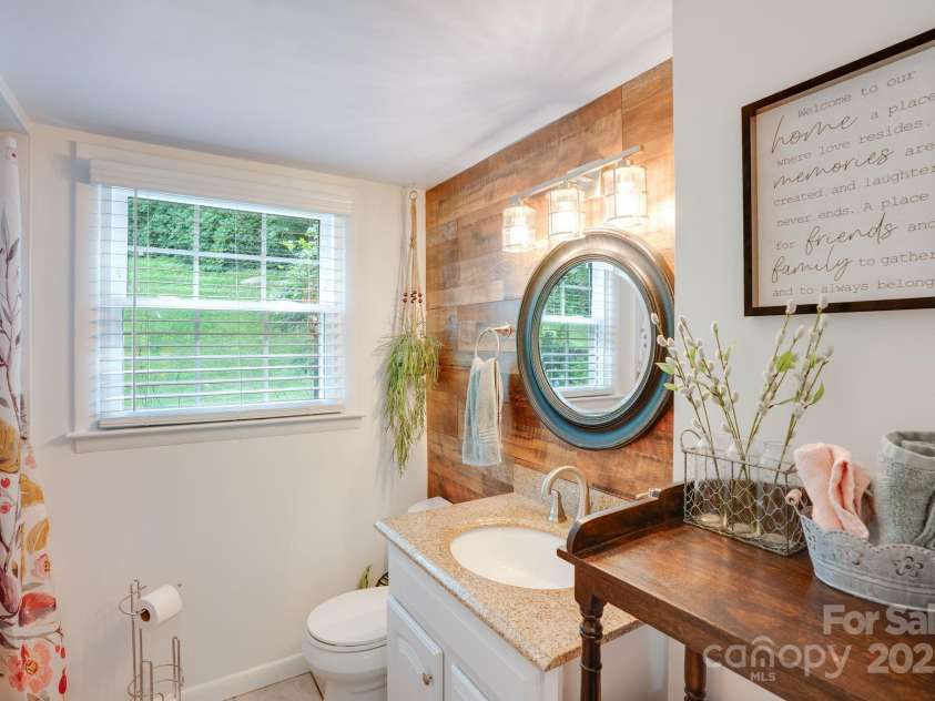 17 Lynwood Circle, Asheville, NC 28806.  MLS# CAR4282982, YatesRealty ID 28260. Shiplap wall in downstairs bathroom