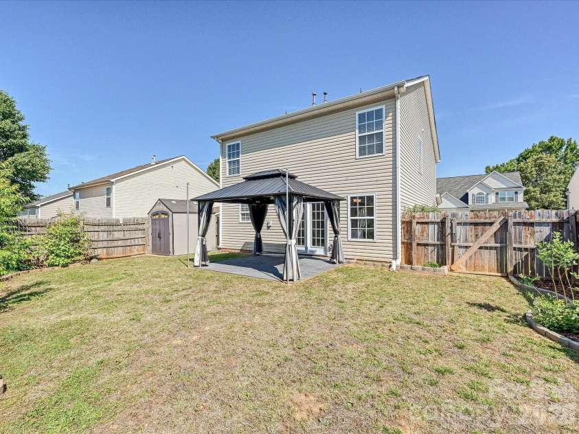3053 Brookchase Boulevard, Fort Mill, SC 29707.  MLS# CAR4374006, YatesRealty ID 28260. Back Yard with Storage Shed