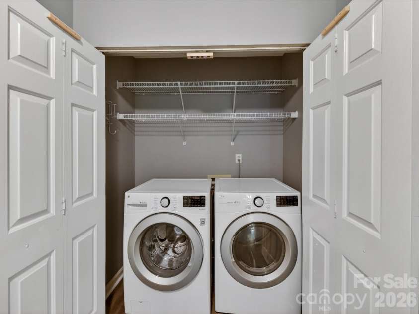 9518 Cedar River Road, Huntersville, NC 28078.  MLS# CAR4381514, YatesRealty ID 28268. Convenient laundry area with built-in shelving and ample storage space offers everyday functionality while keeping household tasks organized and efficient.