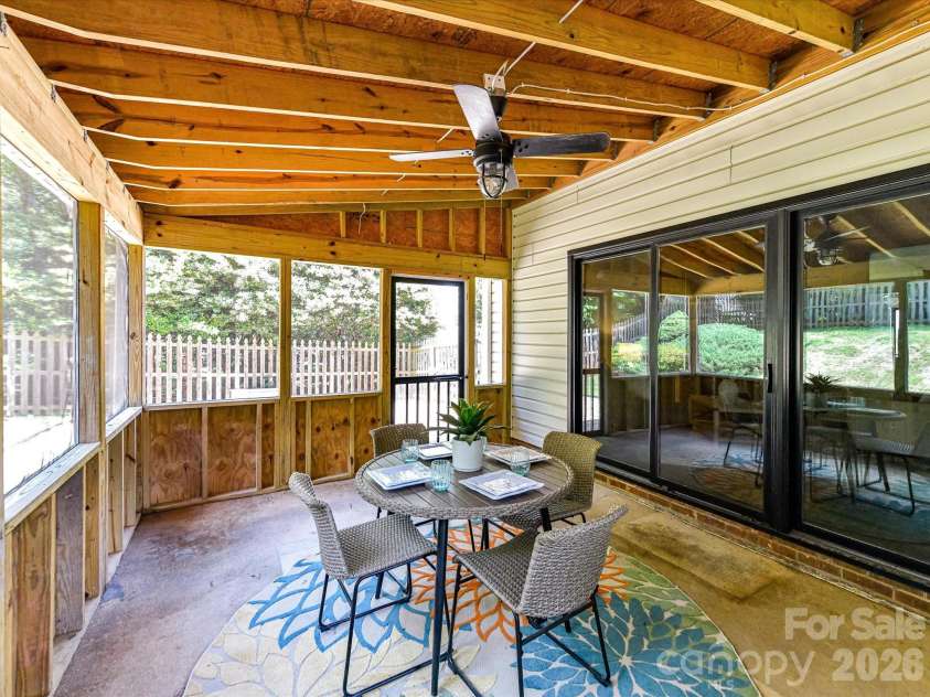 9518 Cedar River Road, Huntersville, NC 28078.  MLS# CAR4381514, YatesRealty ID 28268. Relax and unwind in this spacious screened porch featuring a ceiling fan, peaceful backyard views, and the perfect setting for outdoor dining, morning coffee, or year-round entertaining.