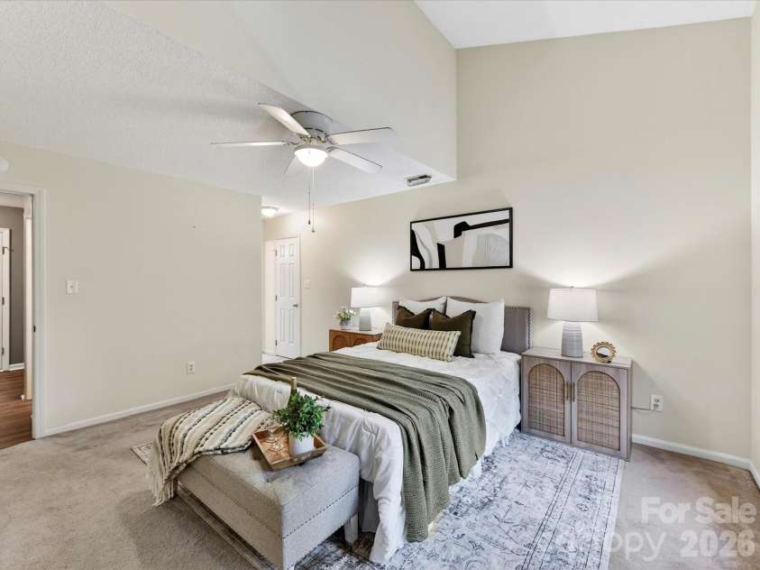 9518 Cedar River Road, Huntersville, NC 28078.  MLS# CAR4381514, YatesRealty ID 28268. Spacious primary suite features vaulted ceilings, abundant natural light, plush carpeting, and a relaxing retreat-like atmosphere with plenty of room to unwind.