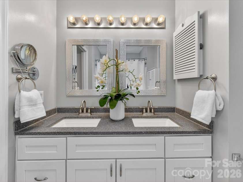 9518 Cedar River Road, Huntersville, NC 28078.  MLS# CAR4381514, YatesRealty ID 28268. Updated primary bathroom features dual vanities, modern finishes, and a functional layout designed to provide comfort, convenience, and a spa-like feel for everyday living.