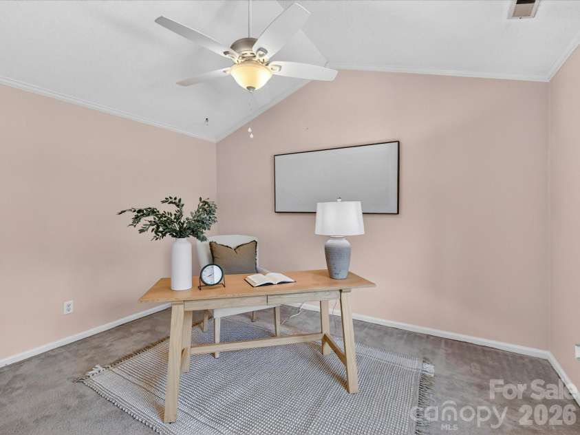 9518 Cedar River Road, Huntersville, NC 28078.  MLS# CAR4381514, YatesRealty ID 28268. Versatile secondary bedroom with vaulted ceilings, soft natural light, and flexible layout offers the perfect space for a guest room, home office, nursery, or creative retreat.