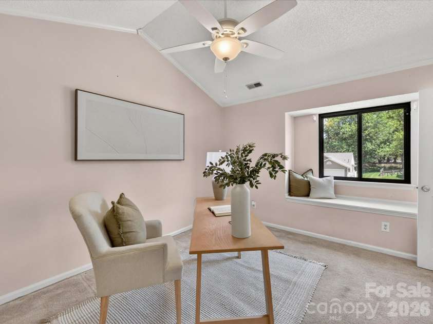9518 Cedar River Road, Huntersville, NC 28078.  MLS# CAR4381514, YatesRealty ID 28268. Versatile secondary bedroom with vaulted ceilings, soft natural light, and flexible layout offers the perfect space for a guest room, home office, nursery, or creative retreat.