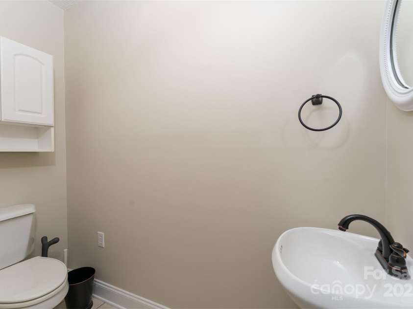 22 Glen Cove Road, Arden, NC 28704.  MLS# CAR4272199, YatesRealty ID 28269. Half bathroom off of the mudroom.