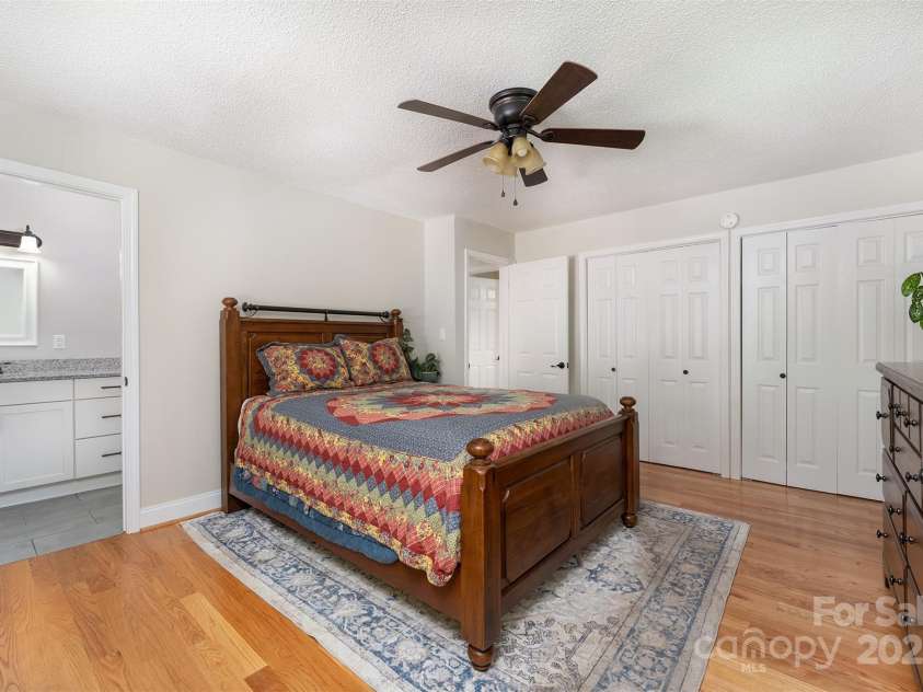 22 Glen Cove Road, Arden, NC 28704.  MLS# CAR4272199, YatesRealty ID 28269. Primary bedroom with two closets.