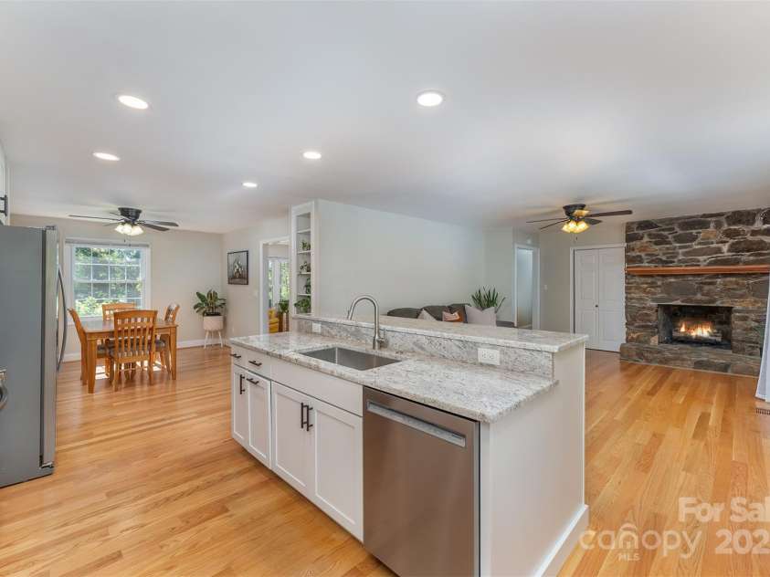 22 Glen Cove Road, Arden, NC 28704.  MLS# CAR4272199, YatesRealty ID 28269. The kitchen and living areas were tastefully renovated, giving this 1970's home a contemporary feel.