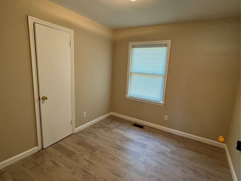 1001 Cone Avenue, Pineville, NC 28134.  MLS# CAR4283461, YatesRealty ID 28275. BEDROOM 1 LVP, BLINDS LIGHTING