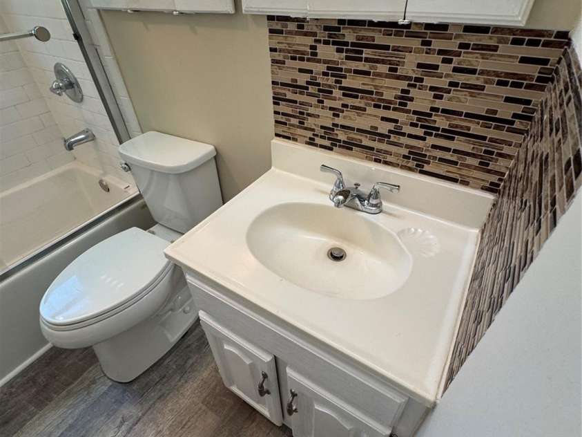 1001 Cone Avenue, Pineville, NC 28134.  MLS# CAR4283461, YatesRealty ID 28275. LAVANETTE LVP FLOORING IN BATH