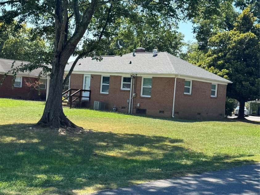 1001 Cone Avenue, Pineville, NC 28134.  MLS# CAR4283461, YatesRealty ID 28275. SIDE REAR VIEW