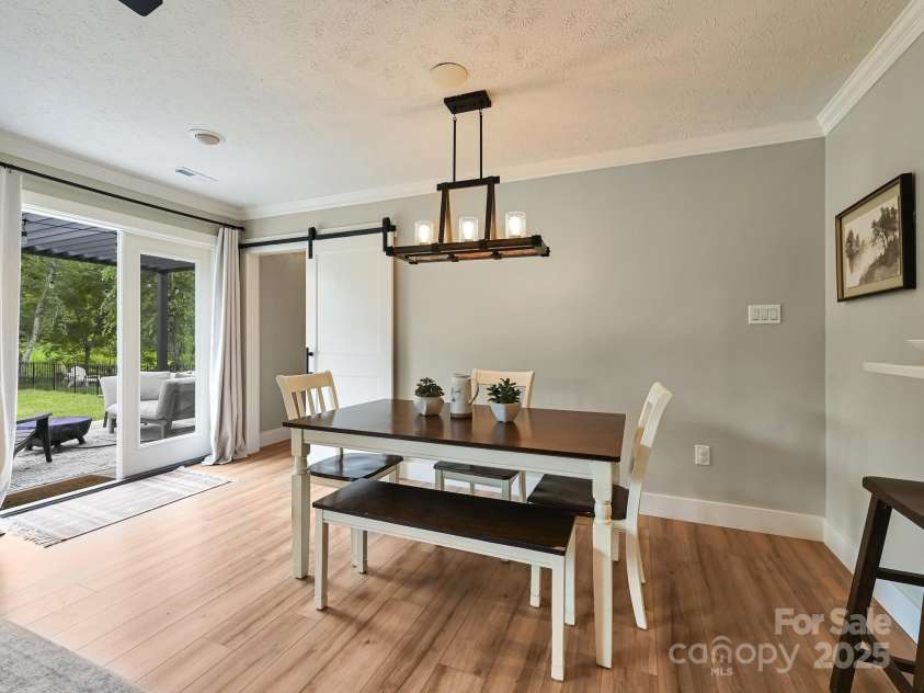 218 Blue Ridge Road, Black Mountain, NC 28711.  MLS# CAR4284698, YatesRealty ID 28276. Dining area steps right out onto back patio