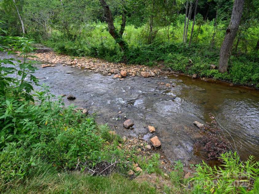 218 Blue Ridge Road, Black Mountain, NC 28711.  MLS# CAR4284698, YatesRealty ID 28276. Enjoy the sounds & peace of the river