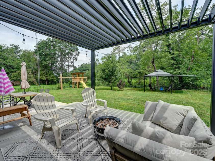 218 Blue Ridge Road, Black Mountain, NC 28711.  MLS# CAR4284698, YatesRealty ID 28276. Patio with an opening and closing louvered cover