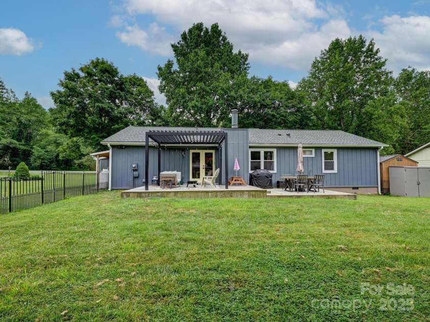 218 Blue Ridge Road, Black Mountain, NC 28711.  MLS# CAR4284698, YatesRealty ID 28276. Rear view of the home with fenced back yard