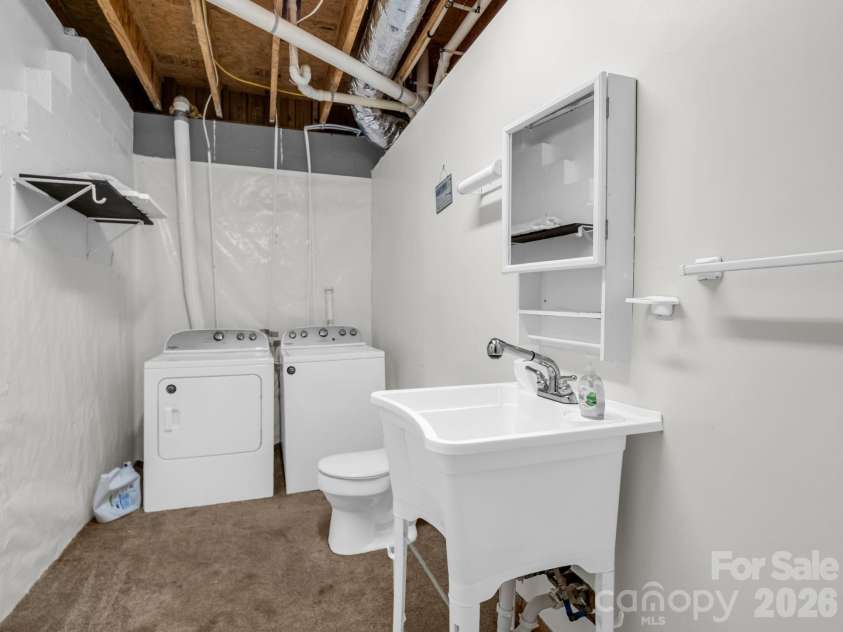 233 Shumont Estates Road, Lake Lure, NC 28746.  MLS# CAR4369348, YatesRealty ID 28283. Basement half bath/utility sink/laundry area