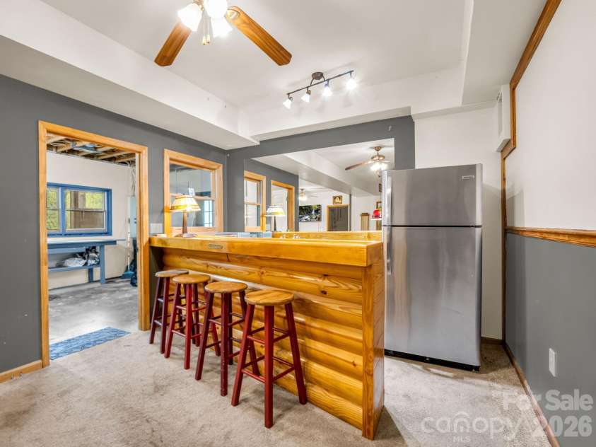 233 Shumont Estates Road, Lake Lure, NC 28746.  MLS# CAR4369348, YatesRealty ID 28283. Built-in bar area with second fridge