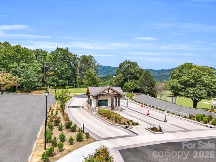 233 Shumont Estates Road, Lake Lure, NC 28746.  MLS# CAR4369348, YatesRealty ID 28283. Rumbling Bald security gate
