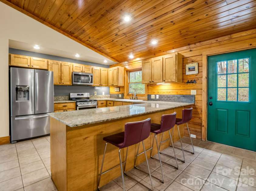 233 Shumont Estates Road, Lake Lure, NC 28746.  MLS# CAR4369348, YatesRealty ID 28283. Updated Kitchen has great bar seating