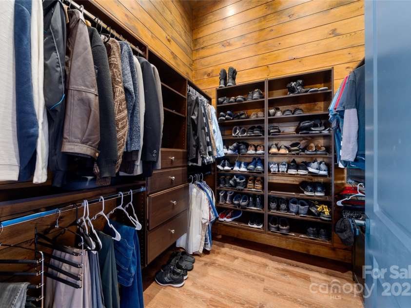41 Ben Lippen School Road, Asheville, NC 28806.  MLS# CAR4316852, YatesRealty ID 28296. Delightful surprise  features abound in this second primary closet such as a hidden pull out mirror. 