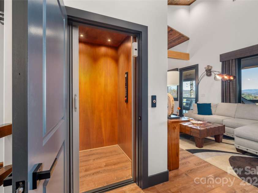 41 Ben Lippen School Road, Asheville, NC 28806.  MLS# CAR4316852, YatesRealty ID 28296. Extra large elevator to all three levels. 950 lb. capacity. 