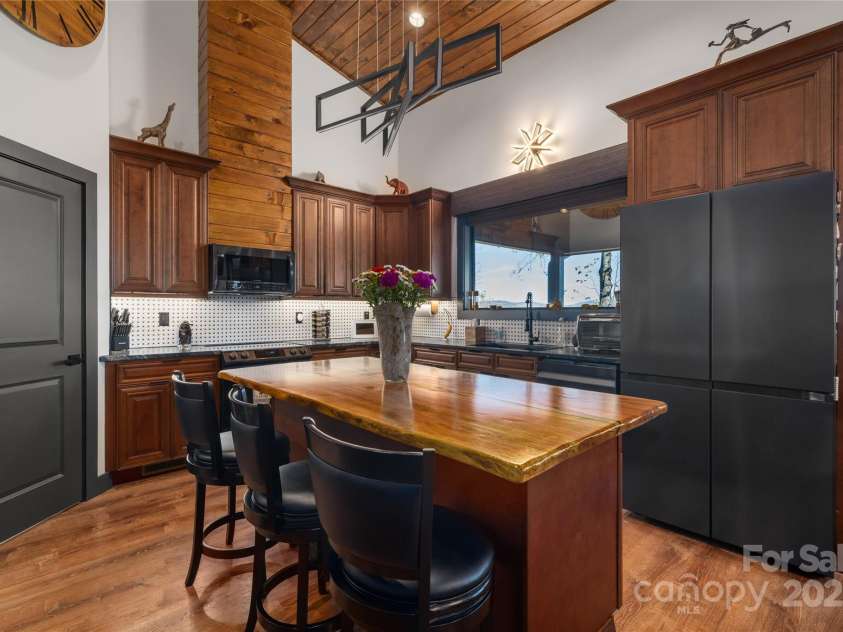 41 Ben Lippen School Road, Asheville, NC 28806.  MLS# CAR4316852, YatesRealty ID 28296. Hand carved, locally sourced center wood island adds so much character and warmth.