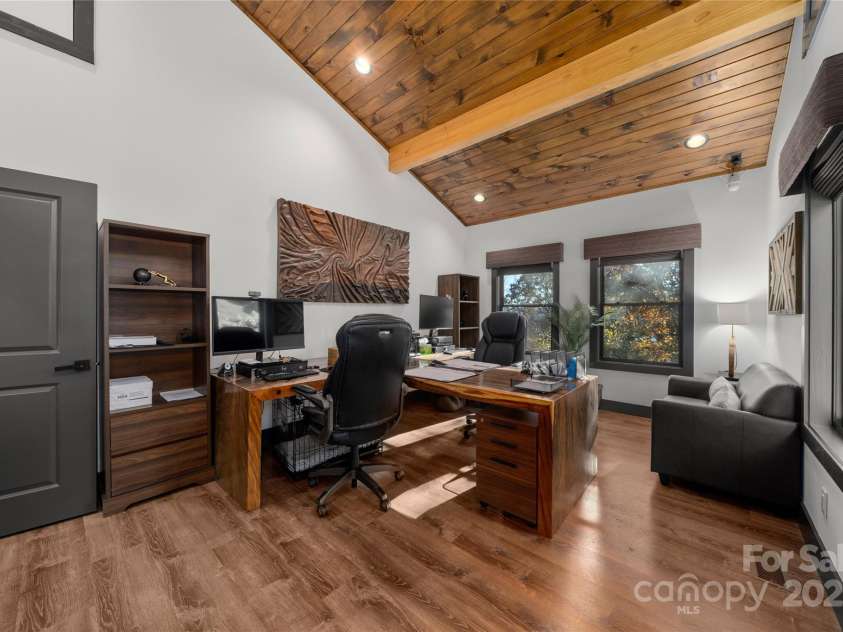 41 Ben Lippen School Road, Asheville, NC 28806.  MLS# CAR4316852, YatesRealty ID 28296. Huge front facing flex room used as a double office with custom closet and access to the partially  finished, full height attic. 