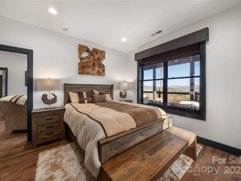 41 Ben Lippen School Road, Asheville, NC 28806.  MLS# CAR4316852, YatesRealty ID 28296. Lower level bedroom one with mountain views.