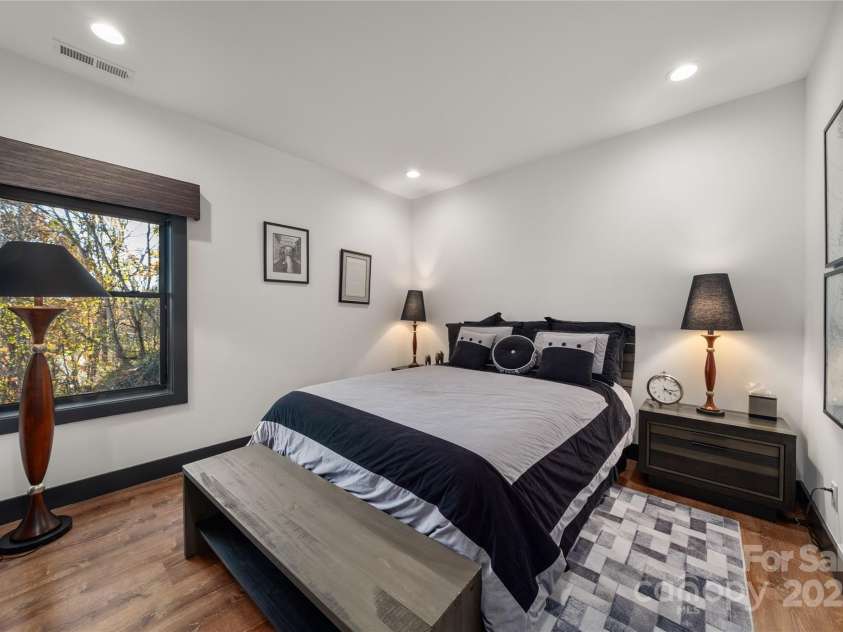 41 Ben Lippen School Road, Asheville, NC 28806.  MLS# CAR4316852, YatesRealty ID 28296. Lower level bedroom two with mountain views.