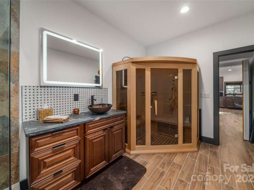 41 Ben Lippen School Road, Asheville, NC 28806.  MLS# CAR4316852, YatesRealty ID 28296. Lower level full bath accessible from both safe room and apartment.