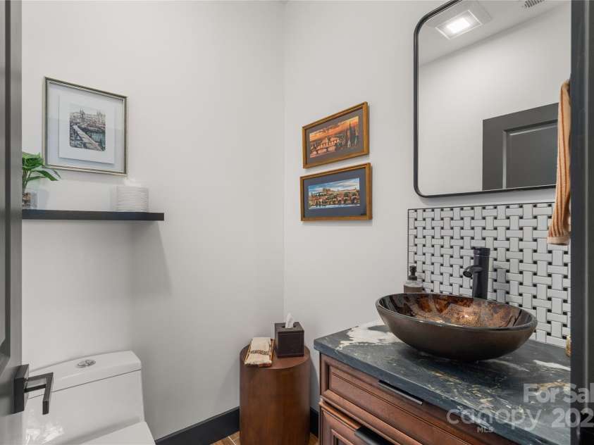 41 Ben Lippen School Road, Asheville, NC 28806.  MLS# CAR4316852, YatesRealty ID 28296. Lower level half bath conveniently located in in main entertainment area. 