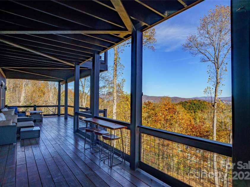 41 Ben Lippen School Road, Asheville, NC 28806.  MLS# CAR4316852, YatesRealty ID 28296. One of two expansive decks with motorized awnings.