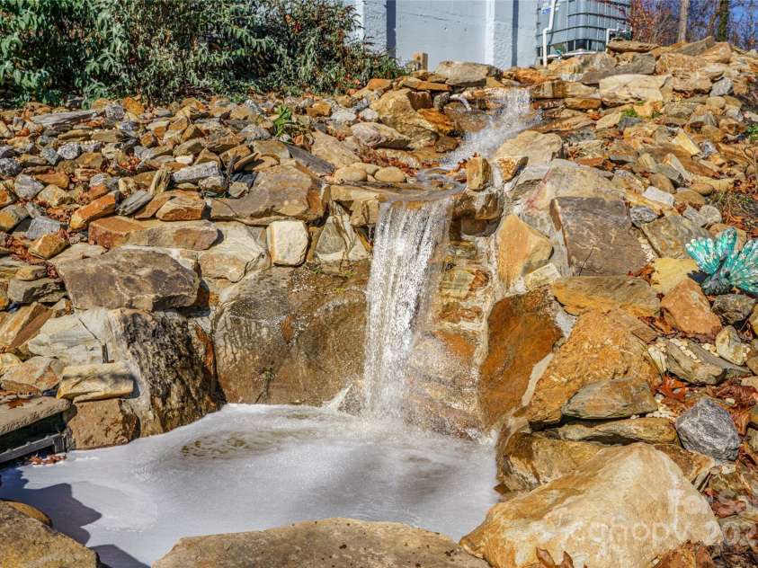 41 Ben Lippen School Road, Asheville, NC 28806.  MLS# CAR4316852, YatesRealty ID 28296. Rushing multi level waterfall adds even more tranquility to the magnificent grounds.  
