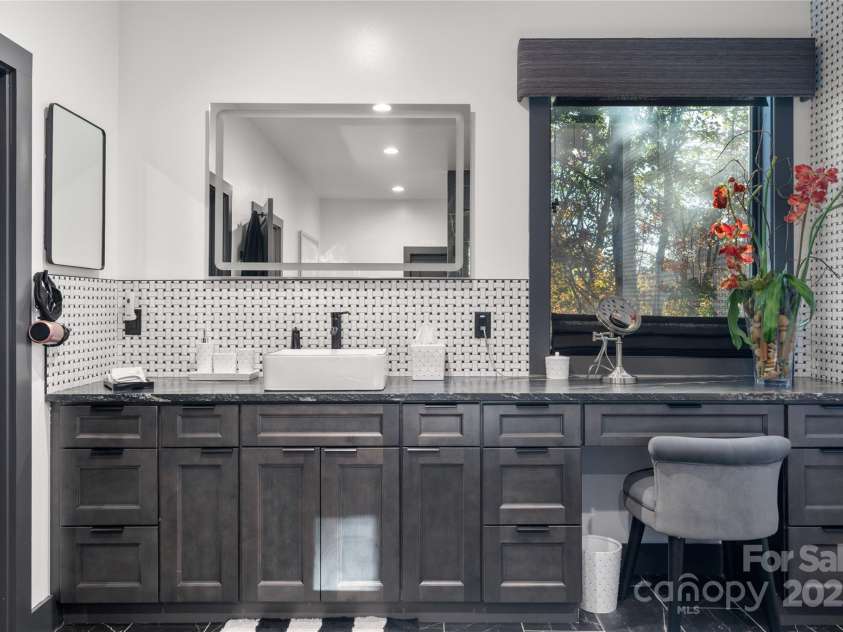 41 Ben Lippen School Road, Asheville, NC 28806.  MLS# CAR4316852, YatesRealty ID 28296. Two spacious, separate prep areas with smart mirrors in this huge primary bathroom.  