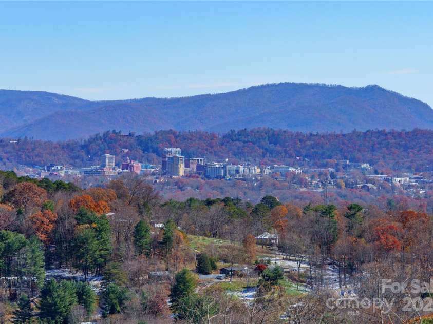 41 Ben Lippen School Road, Asheville, NC 28806.  MLS# CAR4316852, YatesRealty ID 28296. View of downtown Asheville and the Grove Park Inn from all three decks